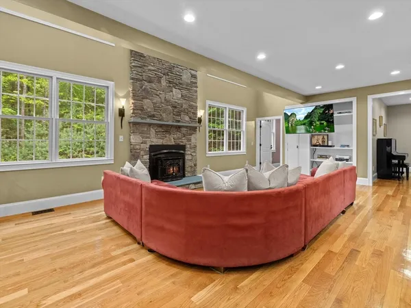 a living room with furniture and a fireplace