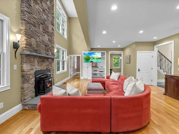 a living room with furniture and a fireplace