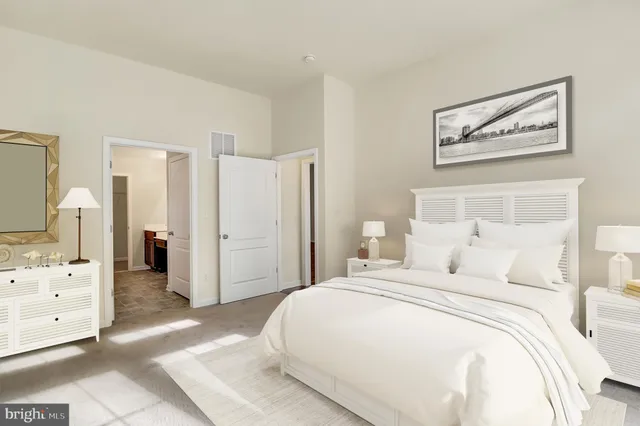 a bedroom with a bed and a cabinets