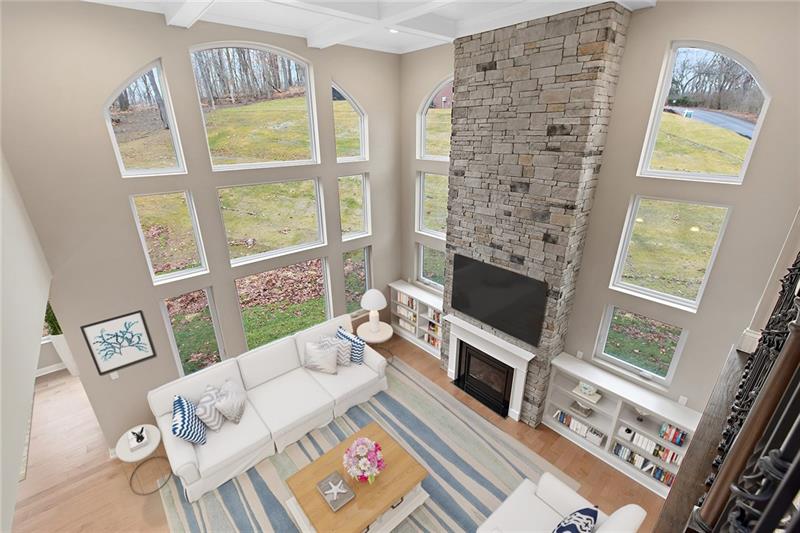 193 Witherow Road Sewickley, PA 15143 - Photo 2 of 25 Grand family room with wall of windows and double level stone fireplace.