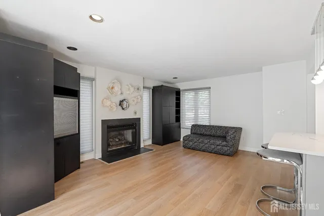 a bedroom with a bed and a fireplace