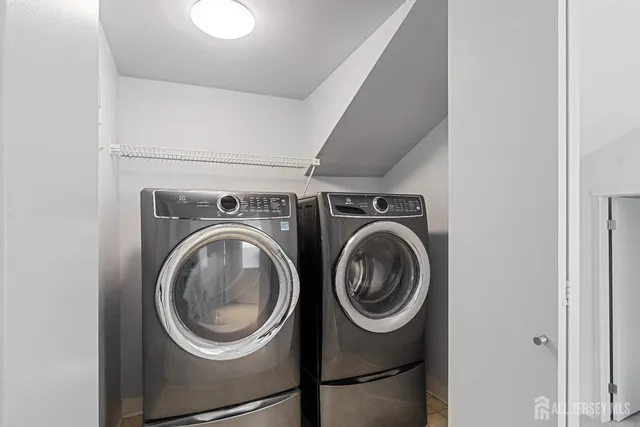 a utility room with dryer and washer