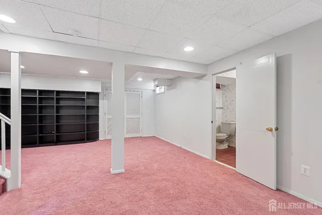 en empty room with window and ceiling fan