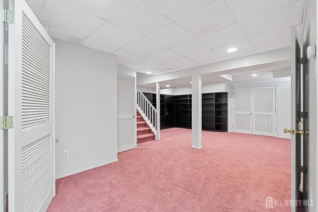 a bathroom with a sink a mirror and a shower