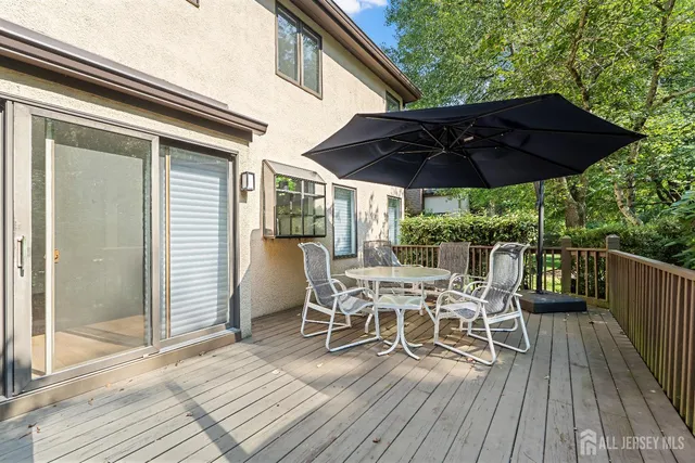 a view of a backyard with swimming pool