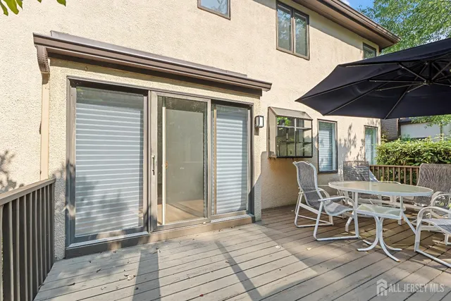 a front view of a house with a garden and porch
