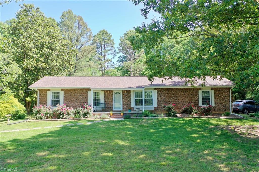 6028 Brantley Gordon Road Denton, NC 27239 - Photo 1 of 34 Gorgeous brick and vinyl home. Large flat front yard. Beautiful and fragrant roses across the front of the home.