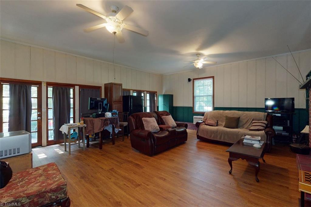 6028 Brantley Gordon Road Denton, NC 27239 - Photo 11 of 34 Previous garage is now HUGE Family room with fireplace and built in shelves.