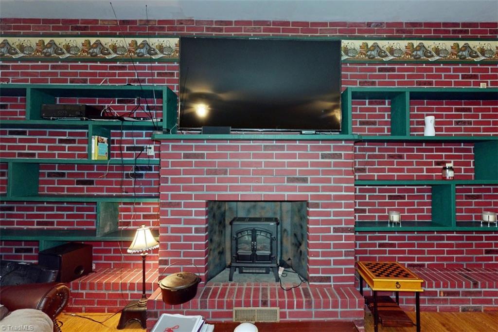 6028 Brantley Gordon Road Denton, NC 27239 - Photo 12 of 34 Gorgeous fireplace with TONS of shelving!