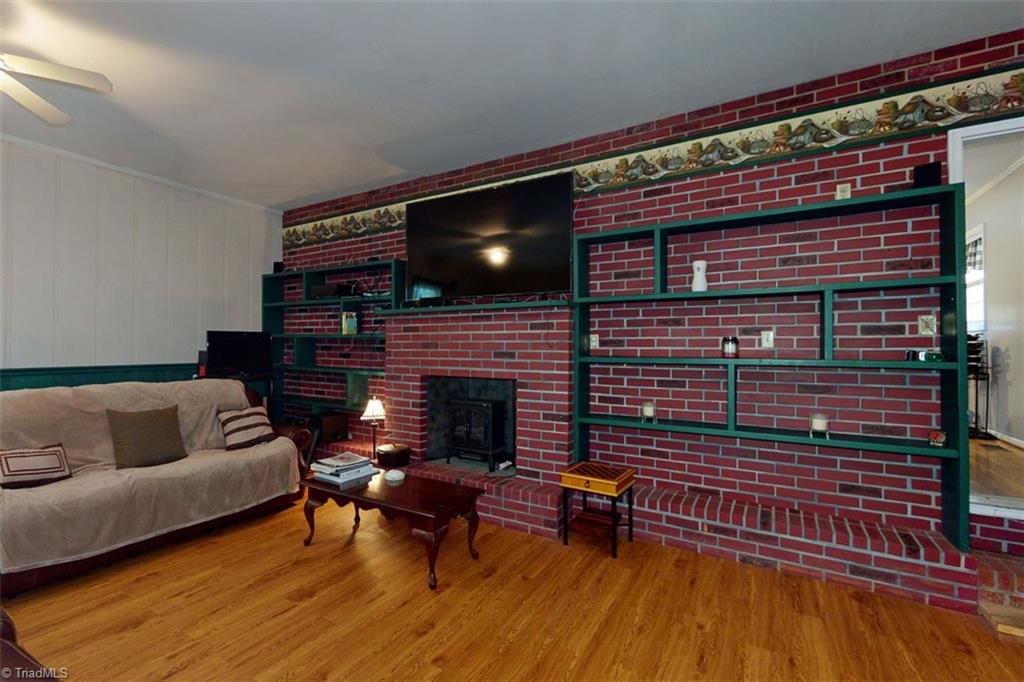 6028 Brantley Gordon Road Denton, NC 27239 - Photo 14 of 34 Converted garage is now a family room with tons of shelves and has space for a big screen TV.
