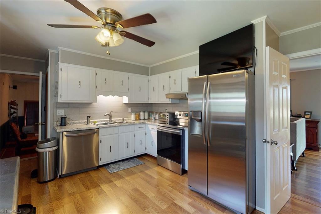 6028 Brantley Gordon Road Denton, NC 27239 - Photo 18 of 34 Nice kitchen in center of home between the family room and living room areas.