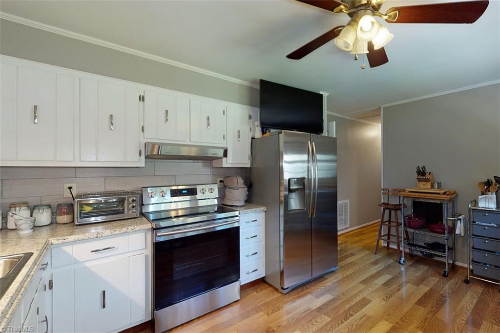 6028 Brantley Gordon Road Denton, NC 27239 - Photo 20 of 34 Nice kitchen, plenty of room for a table and chairs if you want.