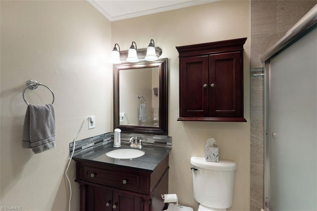 6028 Brantley Gordon Road Denton, NC 27239 - Photo 25 of 34 Master bath with newer vanity, sink and cabinets.