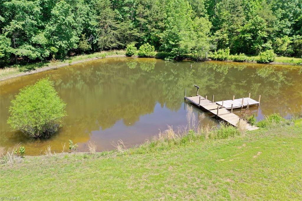 6028 Brantley Gordon Road Denton, NC 27239 - Photo 30 of 34 Lovely pond at the rear of the property. Owner is replacing boards. This pond is very well stocked! Catch and release or catch your dinner!