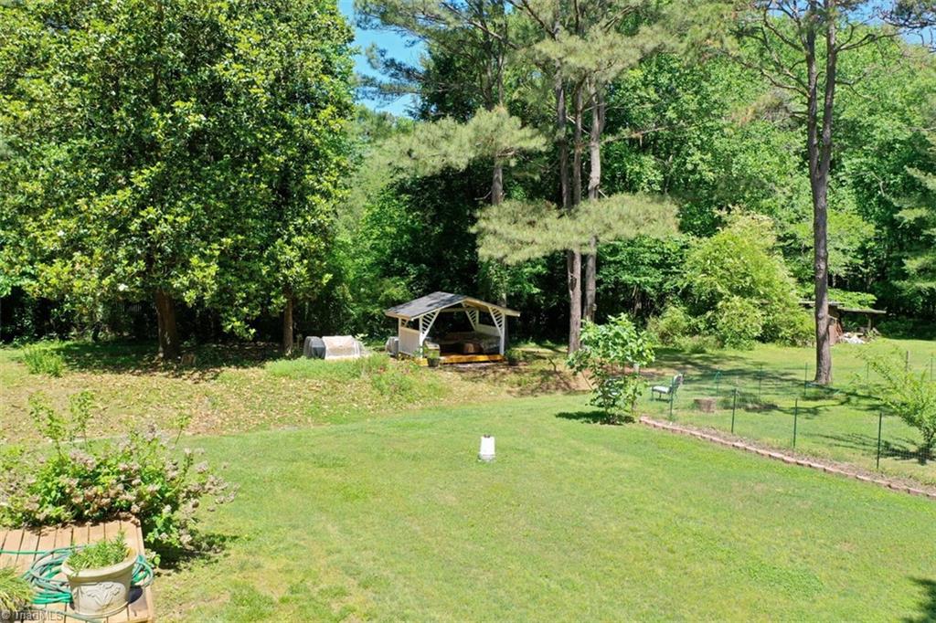 6028 Brantley Gordon Road Denton, NC 27239 - Photo 32 of 34 Lovely back yard. The white bucket in the middle is covering a pump for a pool. Owners covered it, but left the pump in place in case anyone else may want to put a pool there.