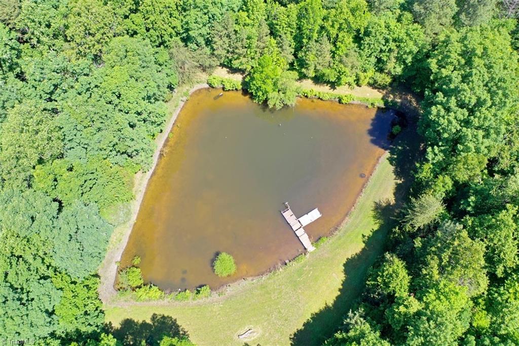 6028 Brantley Gordon Road Denton, NC 27239 - Photo 5 of 34 Drone view of the pond. Yes, it is all on this property!