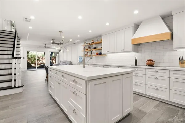 a kitchen with cabinets and window