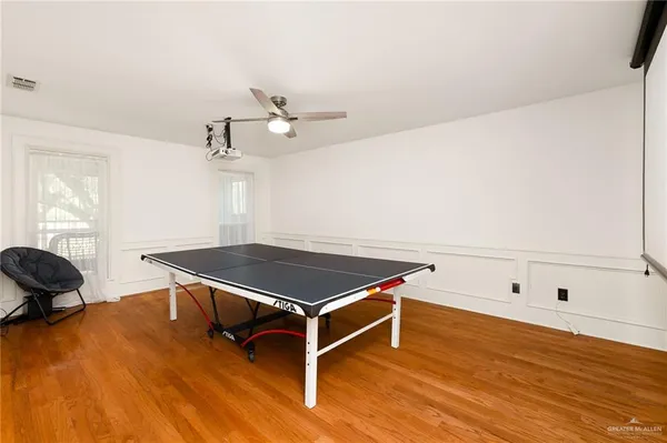a room with furniture and wooden floor
