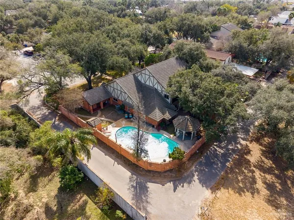 an aerial view of a house with outdoor space