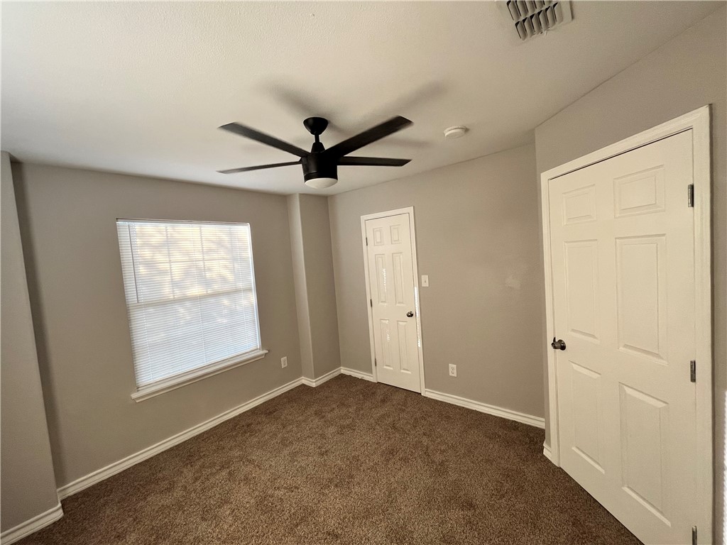 908 East Hefferman Street Beeville, TX 78102 - Photo 31 of 40 a view of a livingroom with a ceiling fan and window