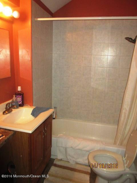 110 Thompson Bridge Road Jackson, NJ 08527 - Photo 2 of 5 a bathroom with a sink and a mirror