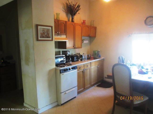 110 Thompson Bridge Road Jackson, NJ 08527 - Photo 4 of 5 a kitchen with stainless steel appliances granite countertop a stove a sink and a refrigerator
