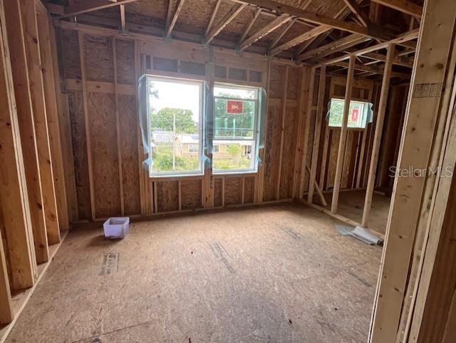1505 Cole Road Orlando, FL 32803 - Photo 15 of 17 a view of an empty room with wooden floor and windows