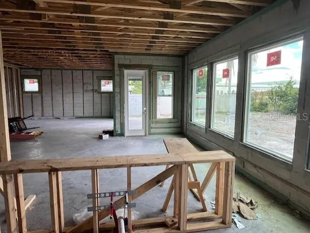 a view of an empty room with a balcony