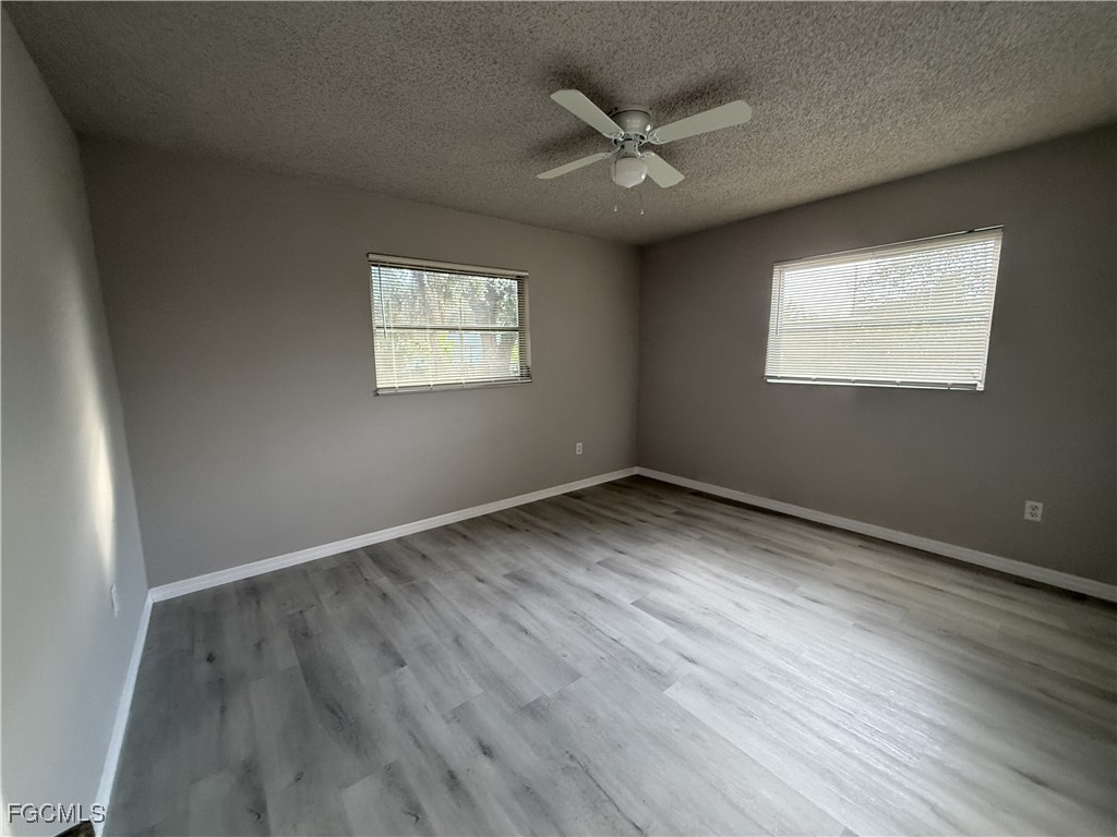 13013 2nd Street Fort Myers, FL 33905 - Photo 12 of 13 an empty room with a window