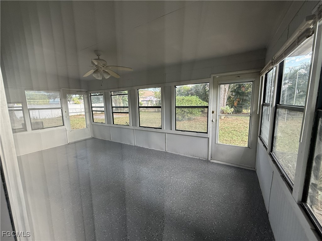 13013 2nd Street Fort Myers, FL 33905 - Photo 9 of 13 wooden floor in an empty room with a window