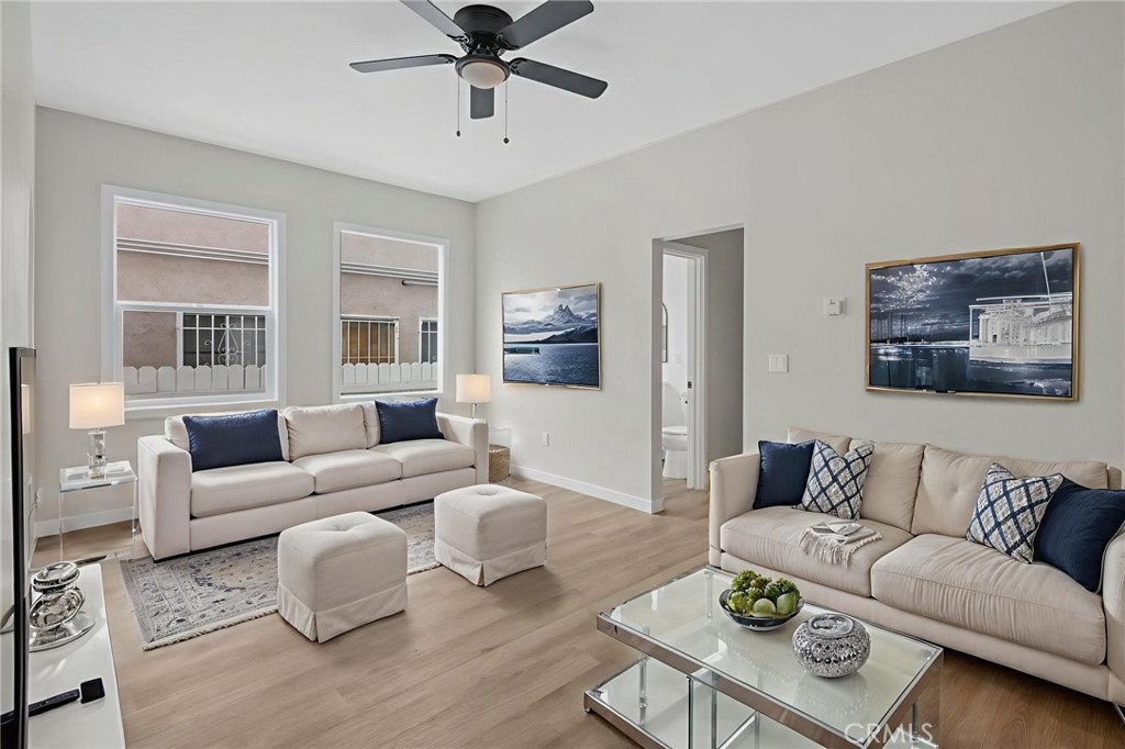 1827 East 4th Street, Unit 7 Long Beach, CA 90802 - Photo 17 of 37 a living room with furniture and a wooden floor