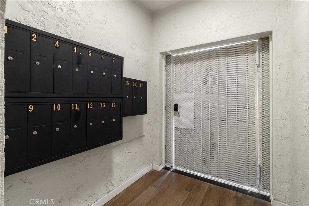 1827 East 4th Street, Unit 7 Long Beach, CA 90802 - Photo 22 of 37 a view of a bedroom with wooden floor