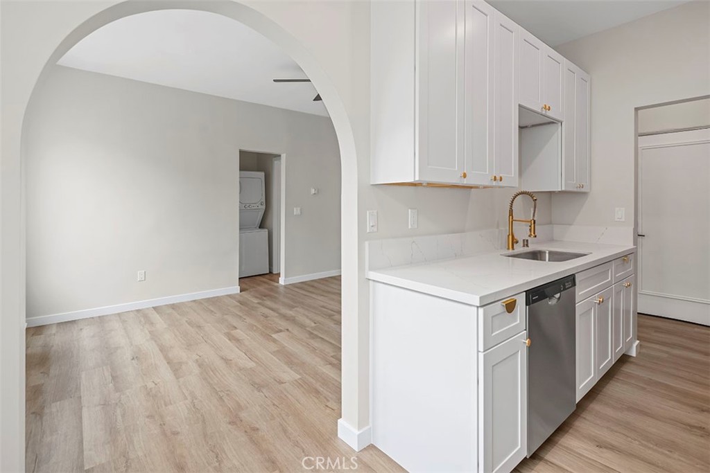 1827 East 4th Street, Unit 7 Long Beach, CA 90802 - Photo 6 of 37 a kitchen with a sink cabinets and wooden floor