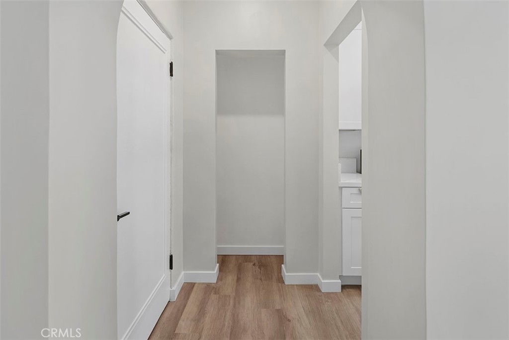 1827 East 4th Street, Unit 7 Long Beach, CA 90802 - Photo 9 of 37 a view of a room with wooden floor and closet