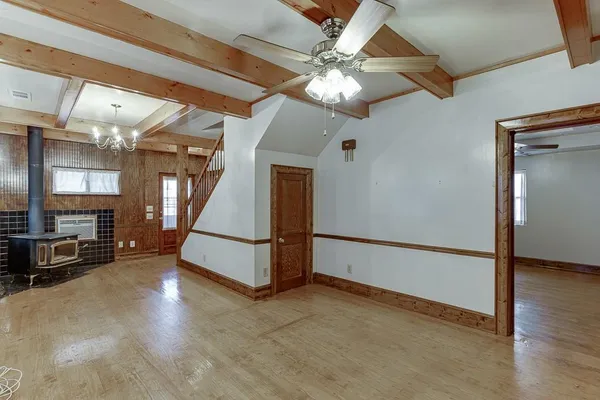 a view of hall way with furniture