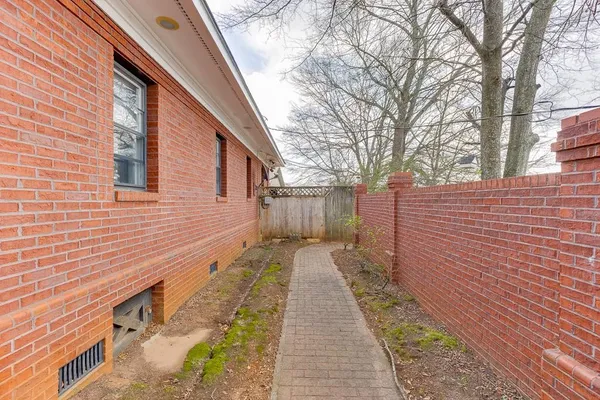 a front view of house with yard outdoor seating and green space
