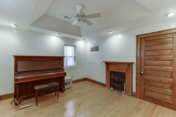 a view of livingroom with hardwood floor and a ceiling fan