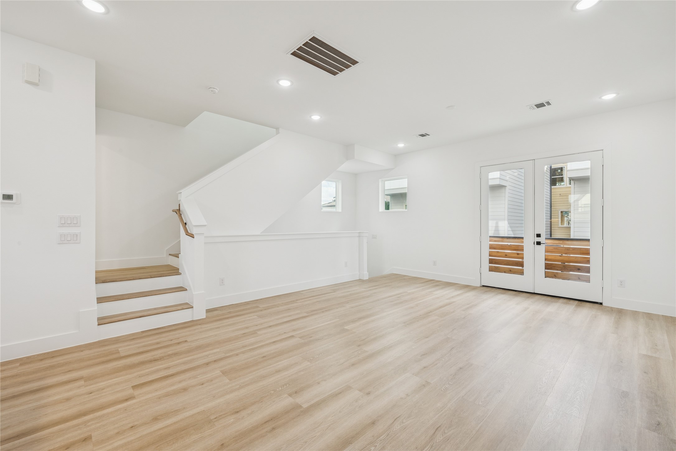111 Milby Street Houston, TX 77003 - Photo 15 of 34 a view of empty room with wooden floor and window