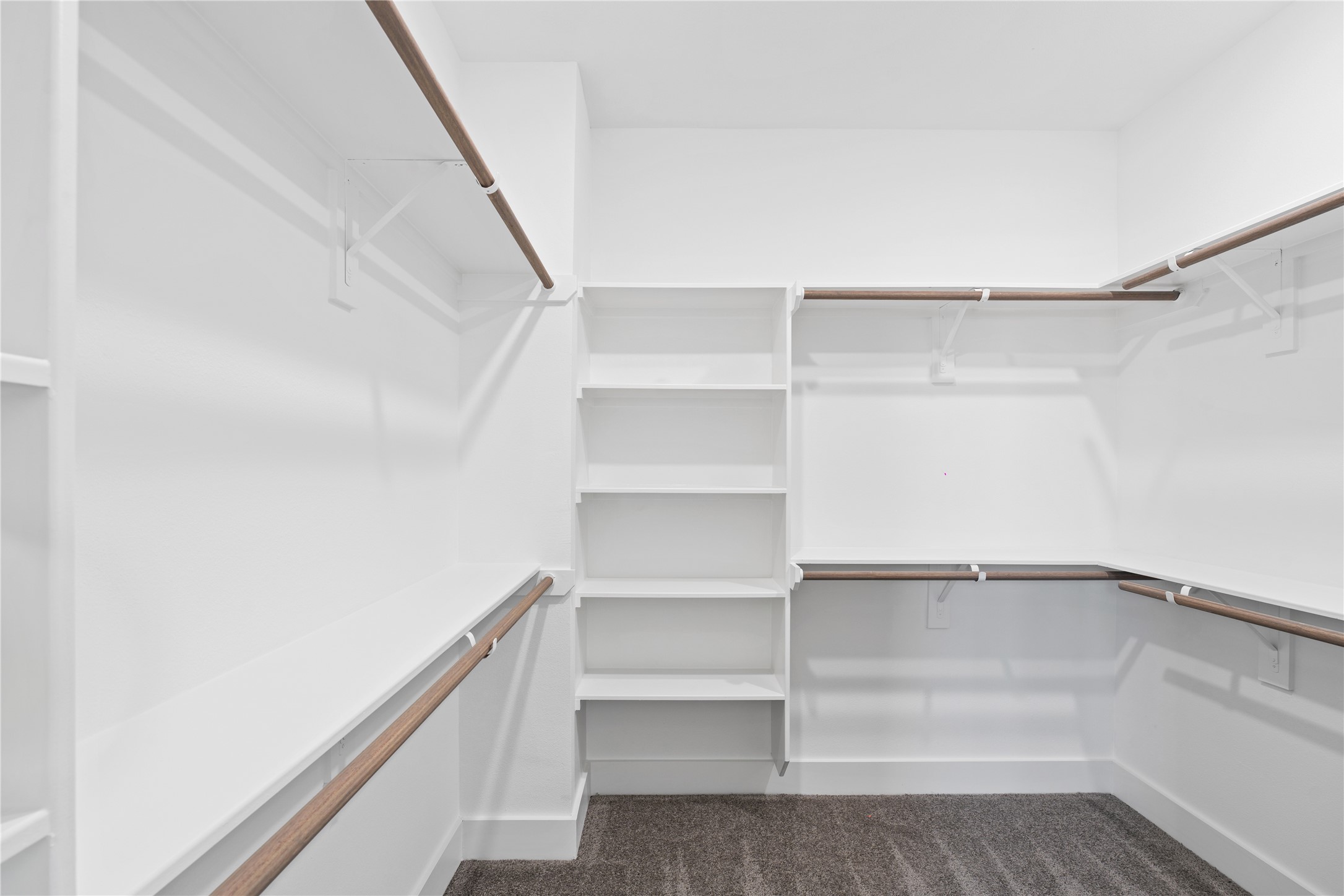 111 Milby Street Houston, TX 77003 - Photo 21 of 34 a view of walk in closet with empty racks