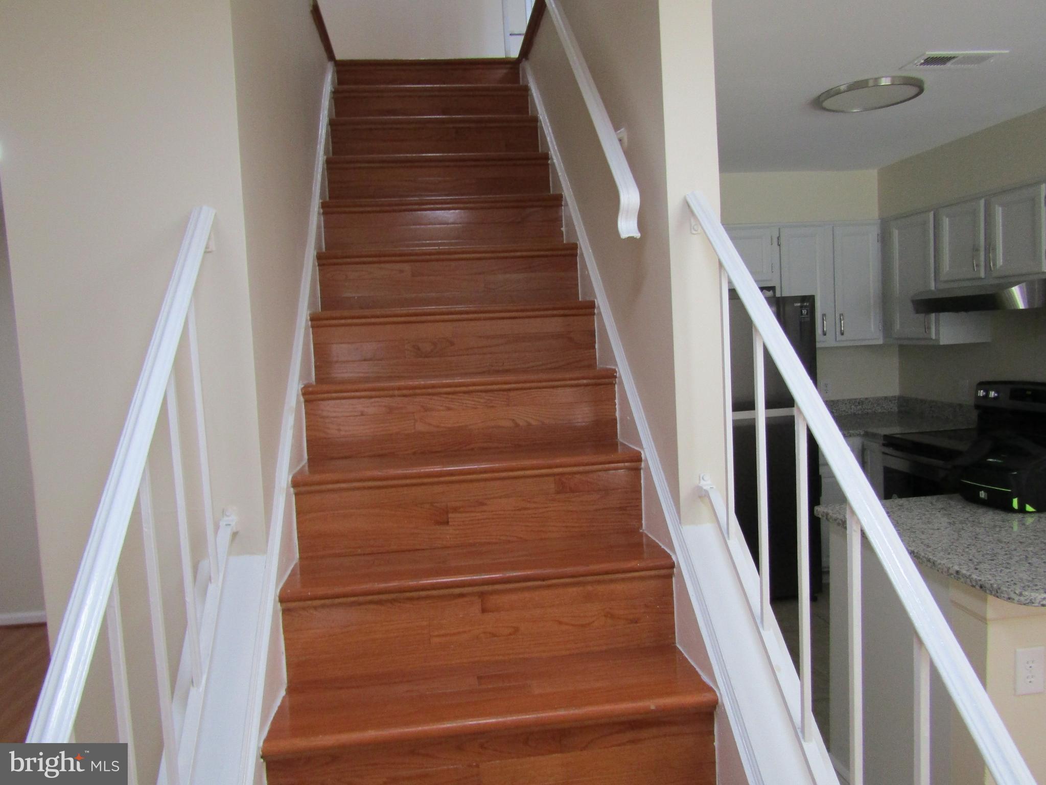 6013 Rabbit Hill Court Centreville, VA 20121 - Photo 26 of 54 Hardwood steps to upper level