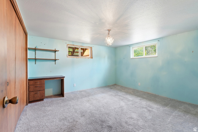 1410 Sumac Drive Logan, UT 84321 - Photo 20 of 28 Room featuring carpeted flooring and light blue walls