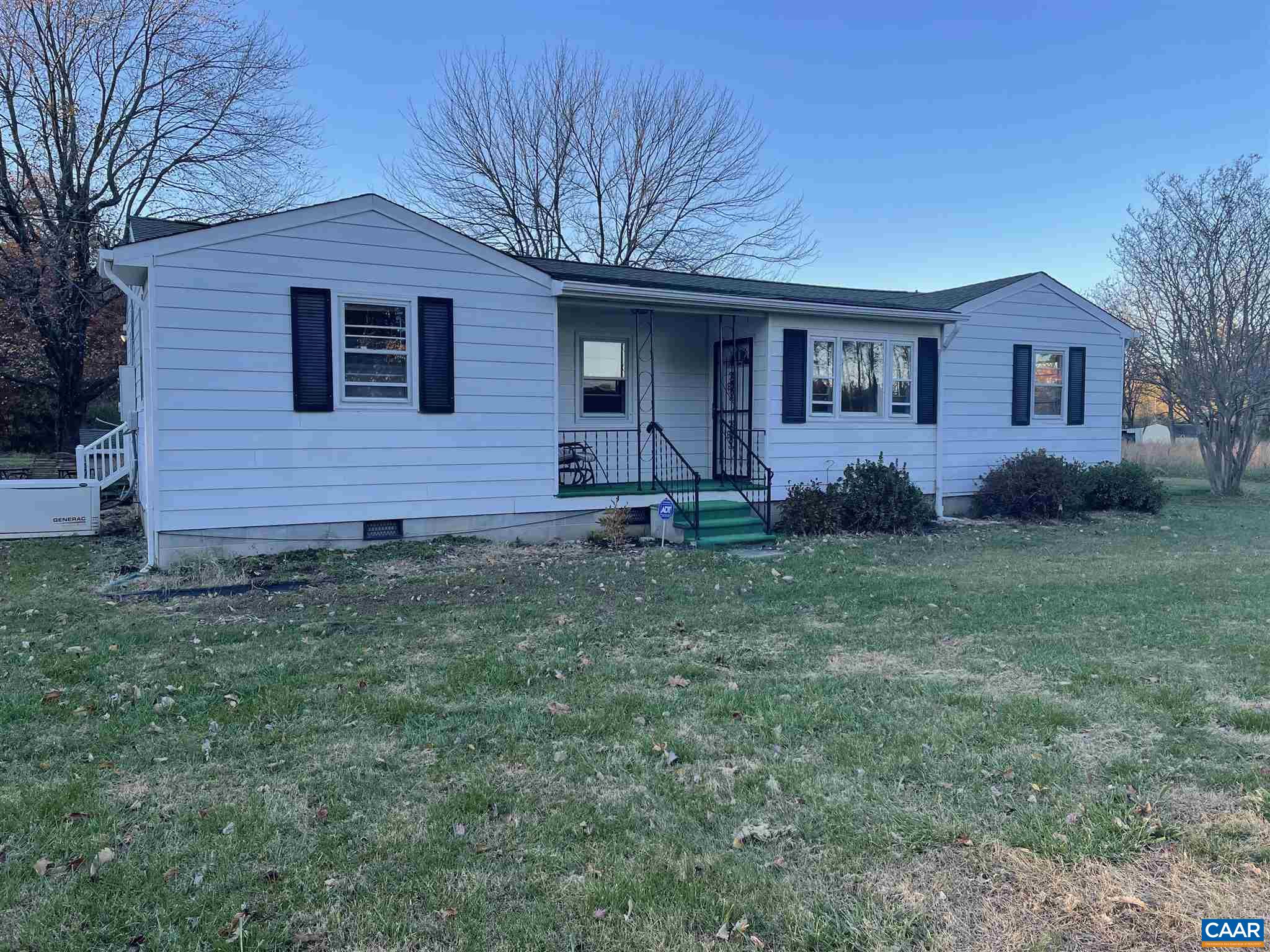 1997 Troy Road Troy, VA 22974 - Photo 1 of 19 a front view of a house with garden
