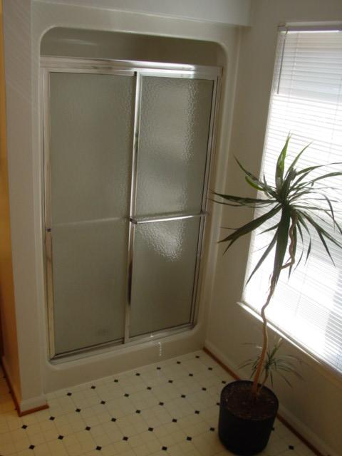 4661 Nemmo Road Vinton, VA 24179 - Photo 17 of 34 a bathroom with a shower and a sink