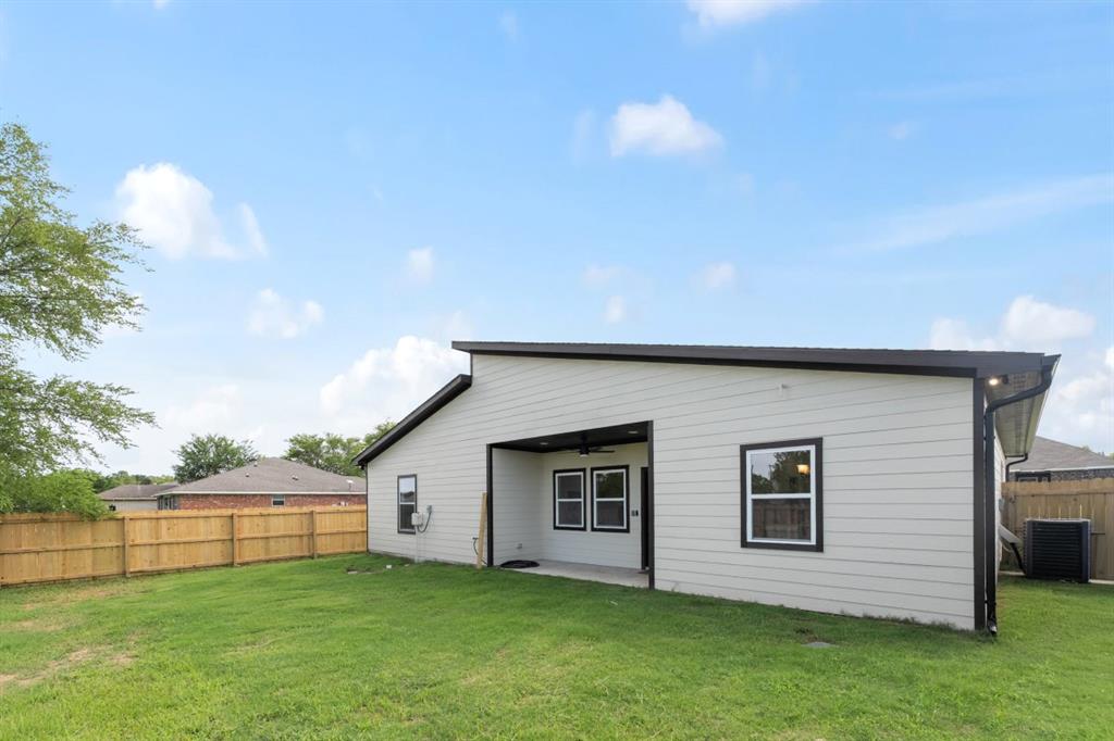 228 Windjammer Road Gun Barrel City, TX 75156 - Photo 18 of 19 a backyard of a house with table and chairs