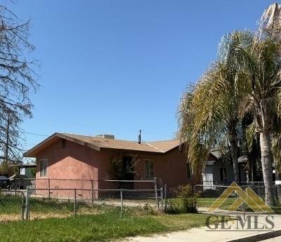 Undisclosed Address Wasco, CA 93280 - Photo 3 of 3 a view of a house with a yard