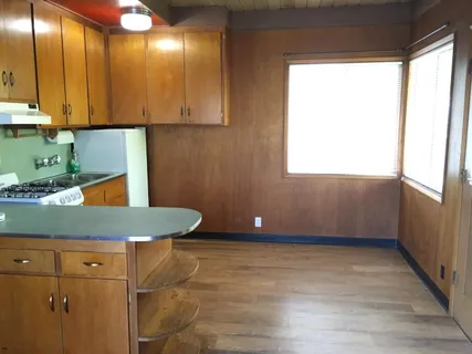 a bathroom with a toilet and a tub