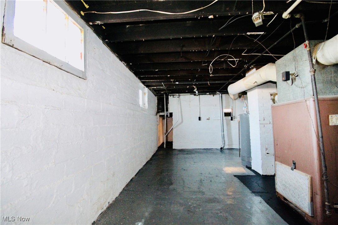 12406 Kinsman Road Cleveland, OH 44120 - Photo 20 of 29 Basement with heating unit and water heater