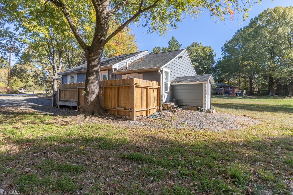 2327 Scalesville Road Summerfield, NC 27358 - Photo 20 of 22 THIS SIDE OF THE HOUSE HAS THE DECK FENCED AREA. TH OTHER AREA IS THE WAY DOWN TO THE CRAWSPACE.