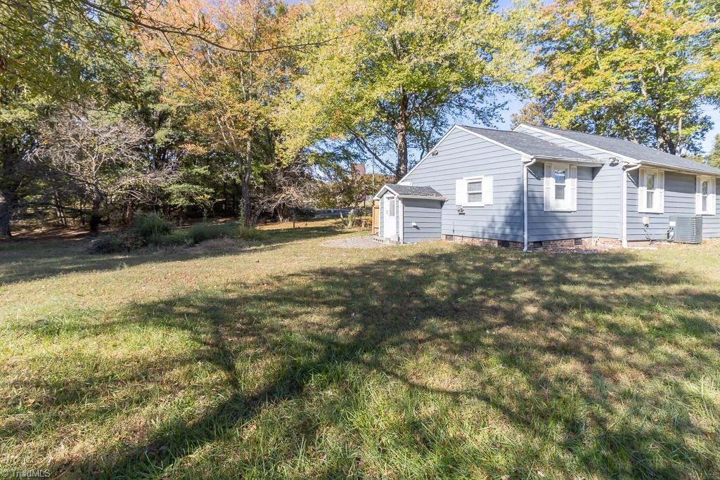 2327 Scalesville Road Summerfield, NC 27358 - Photo 22 of 22 BACK AND SIDE OF THE PROPERTY. NICE SIZE LOT BUT NOT TO LARGE TO TAKE CARE OF.