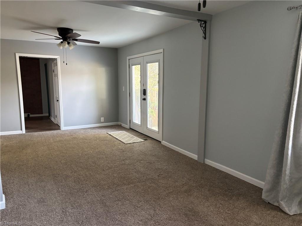 2327 Scalesville Road Summerfield, NC 27358 - Photo 5 of 22 The living room and dining room are part odone lage room.
